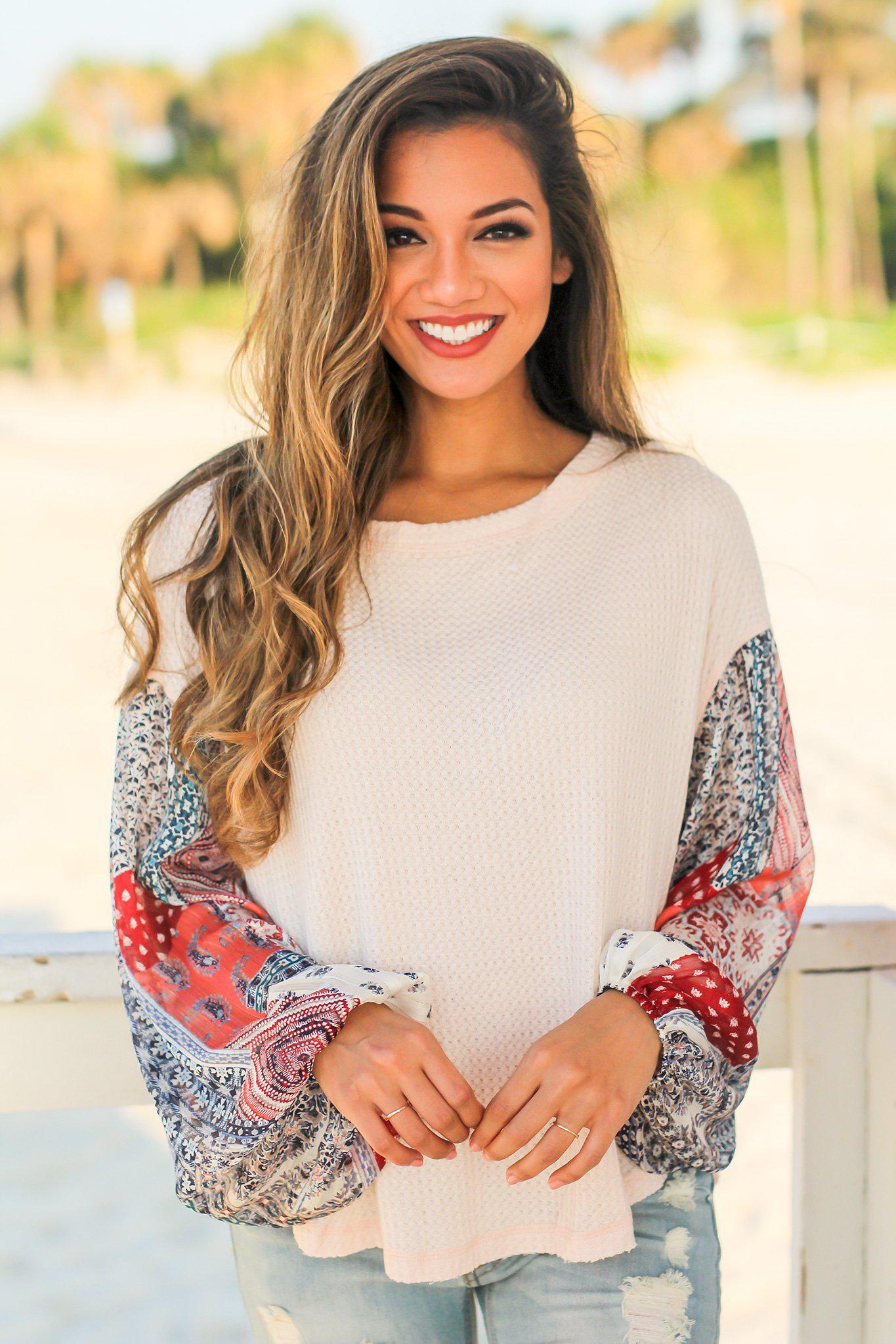 Stylish Light Peach Colored Knit Women's Top Featuring Printed Long Sleeves