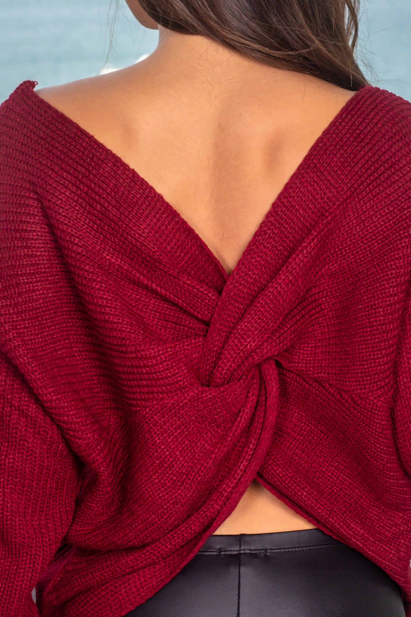 Stylish Burgundy Knitted Women's Sweater Featuring a Unique Twist Detail