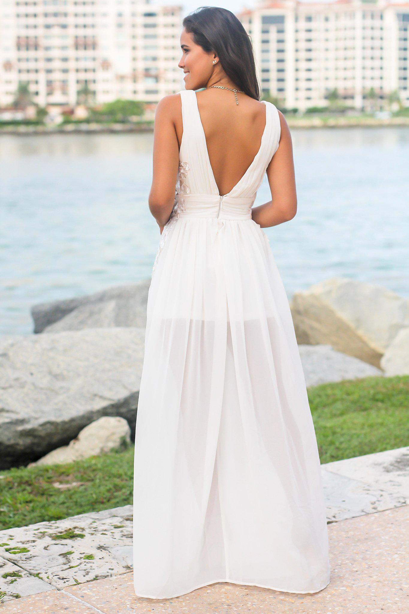 Elegant Ivory Pleated Maxi Dress with Intricate Embroidered Sides