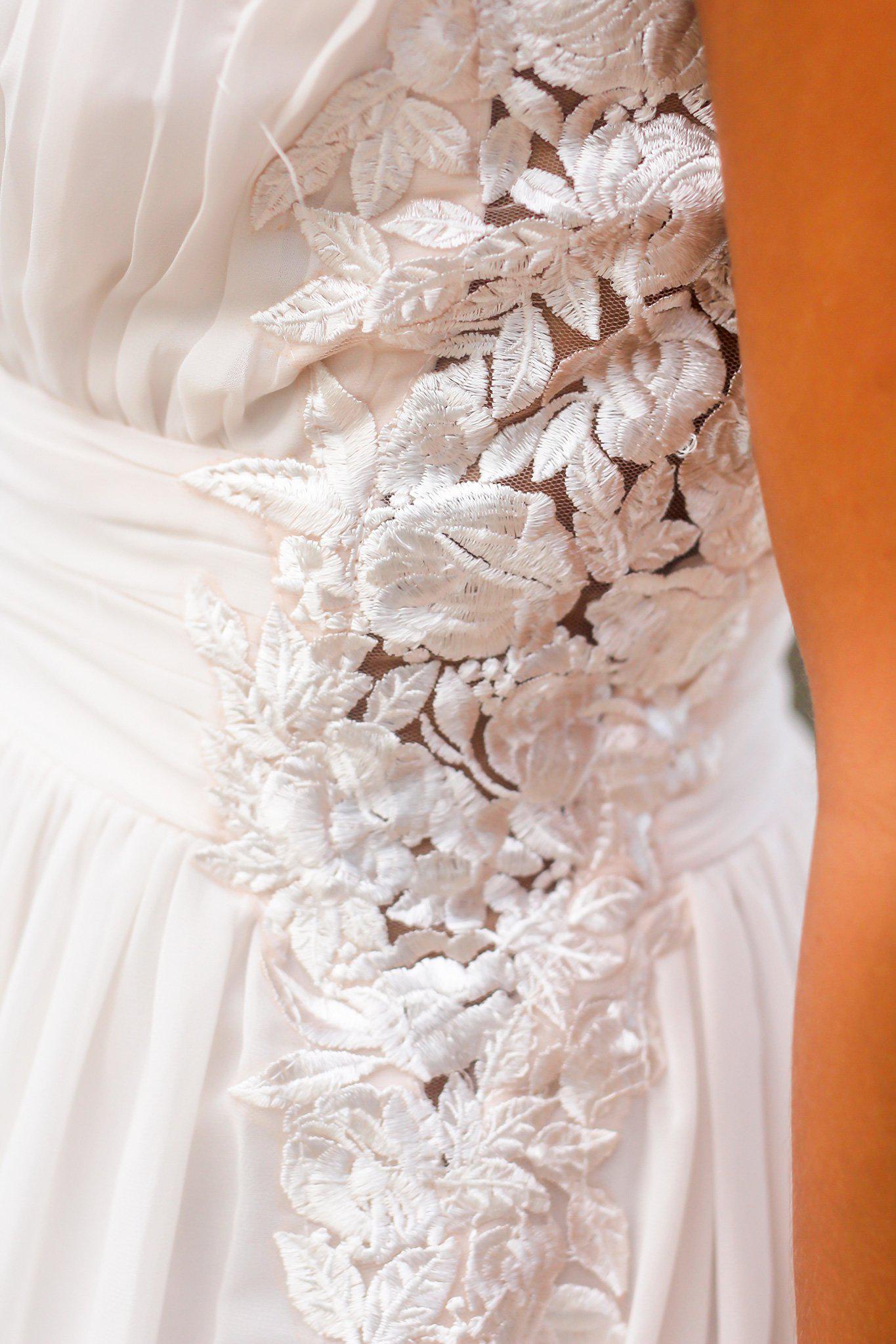 Elegant Ivory Pleated Maxi Dress with Intricate Embroidered Sides