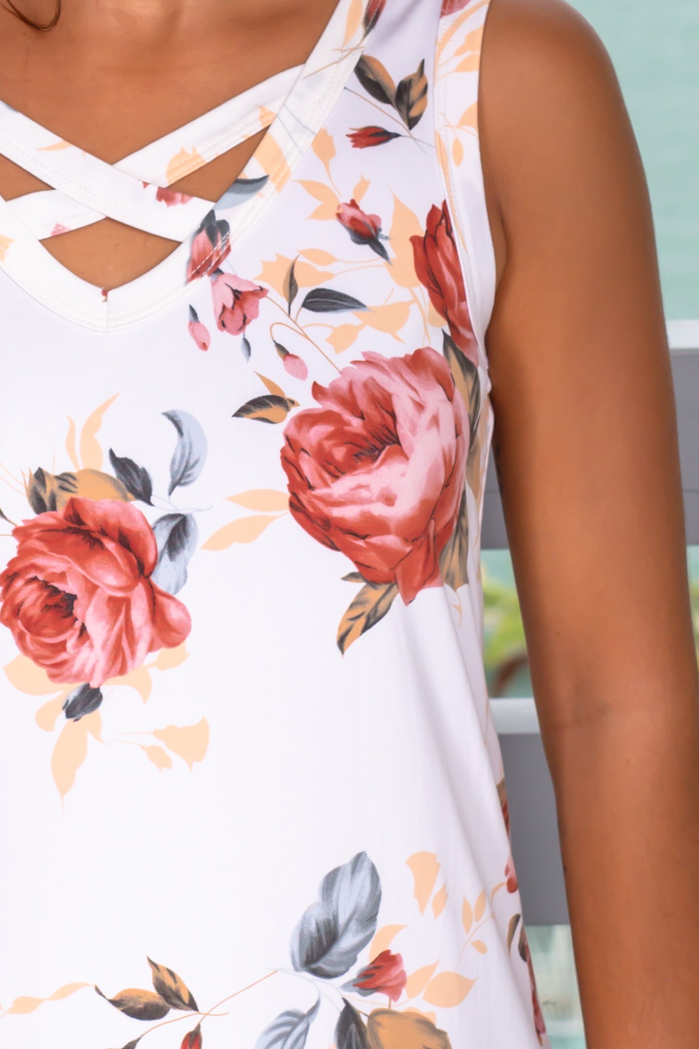 Ladies' Ivory Floral Sleeveless Top with Stylish Criss Cross Design