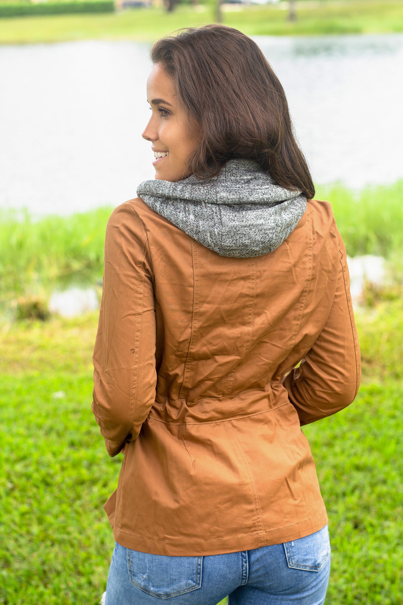 Stylish Camel Jacket with Gray Hood and Functional Pockets