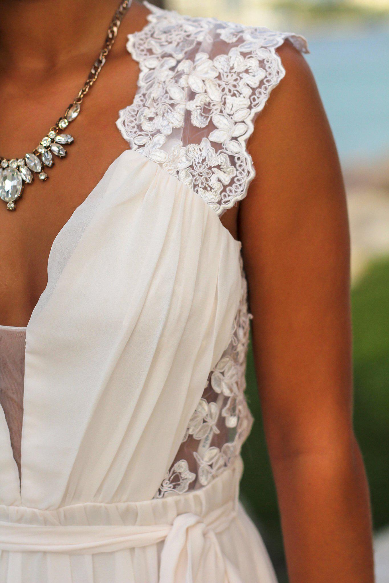 Elegant Ivory Sleeveless Maxi Dress with Embroidered Open Back