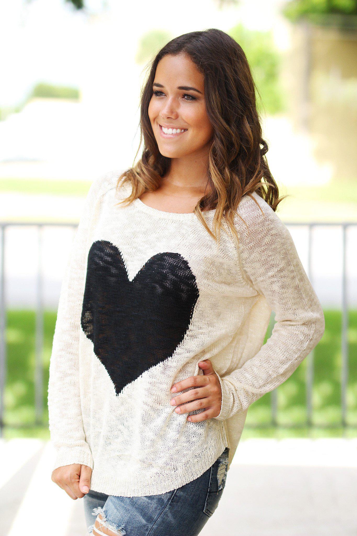Charming Ivory Knit Women's Sweater Adorned With A Black Heart Design