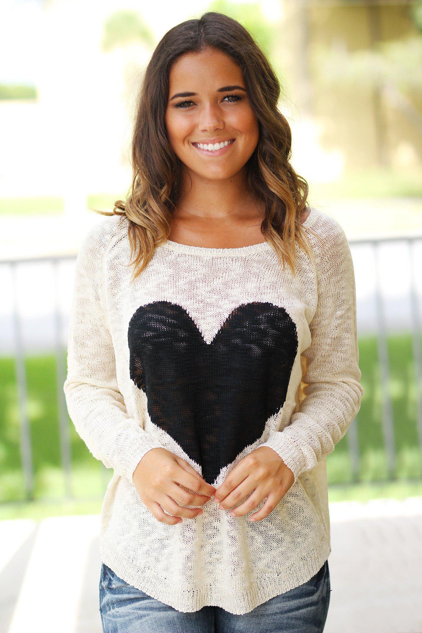 Charming Ivory Knit Women's Sweater Adorned With A Black Heart Design