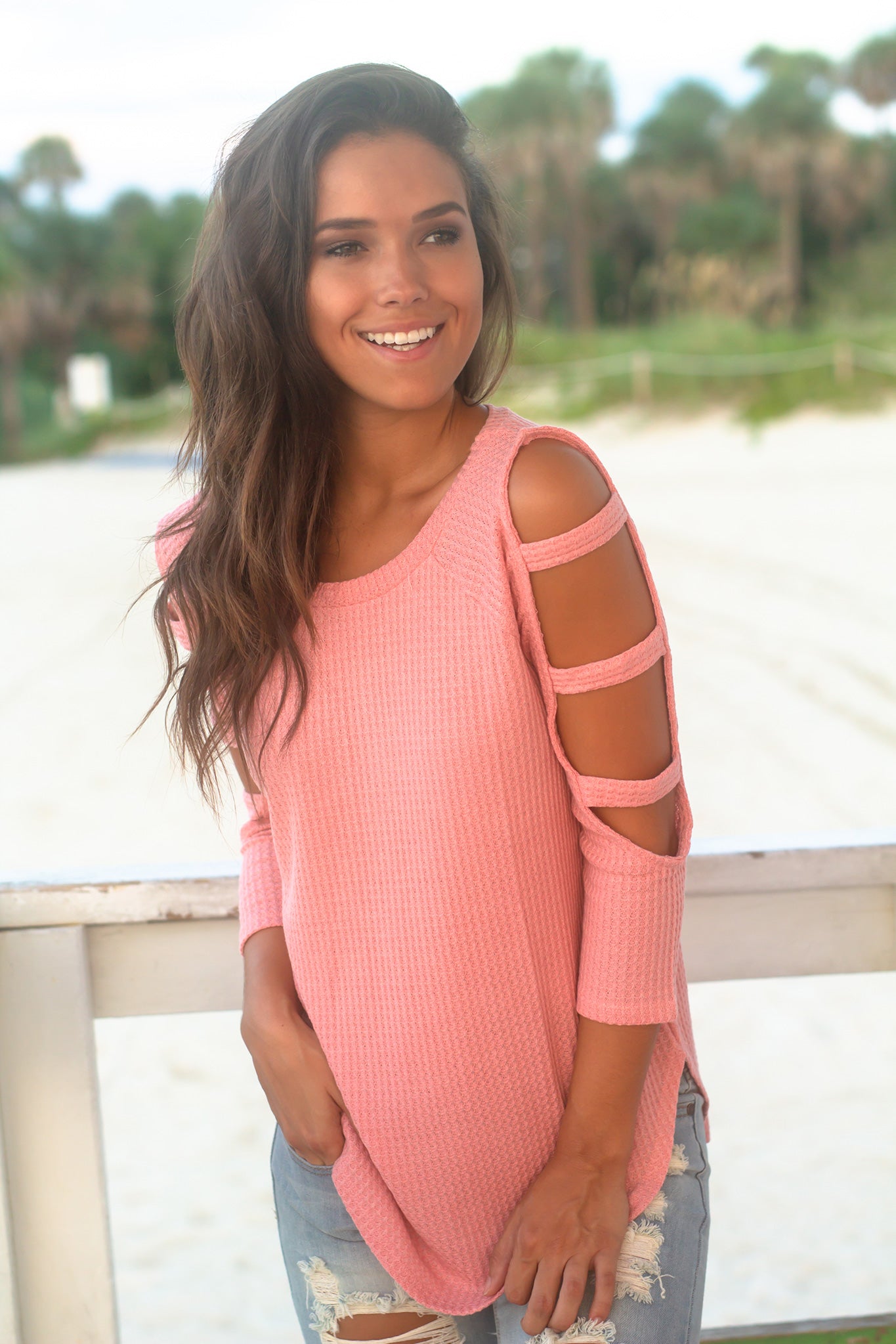 Feminine Coral Knit Women's Top with Fashionable Cut Out Sleeve Design