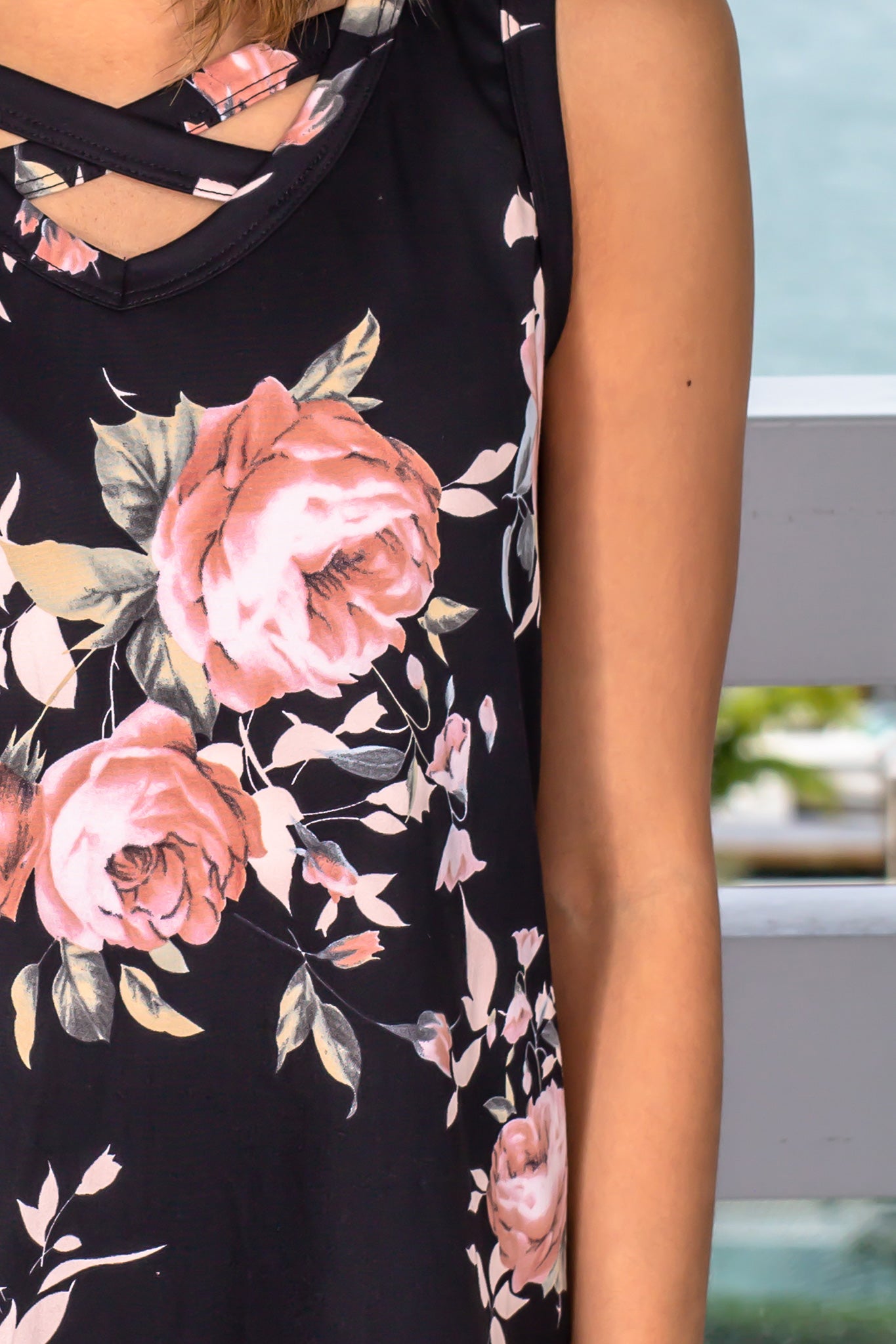 Stylish Black Floral Sleeveless Top with Unique Criss Cross Design