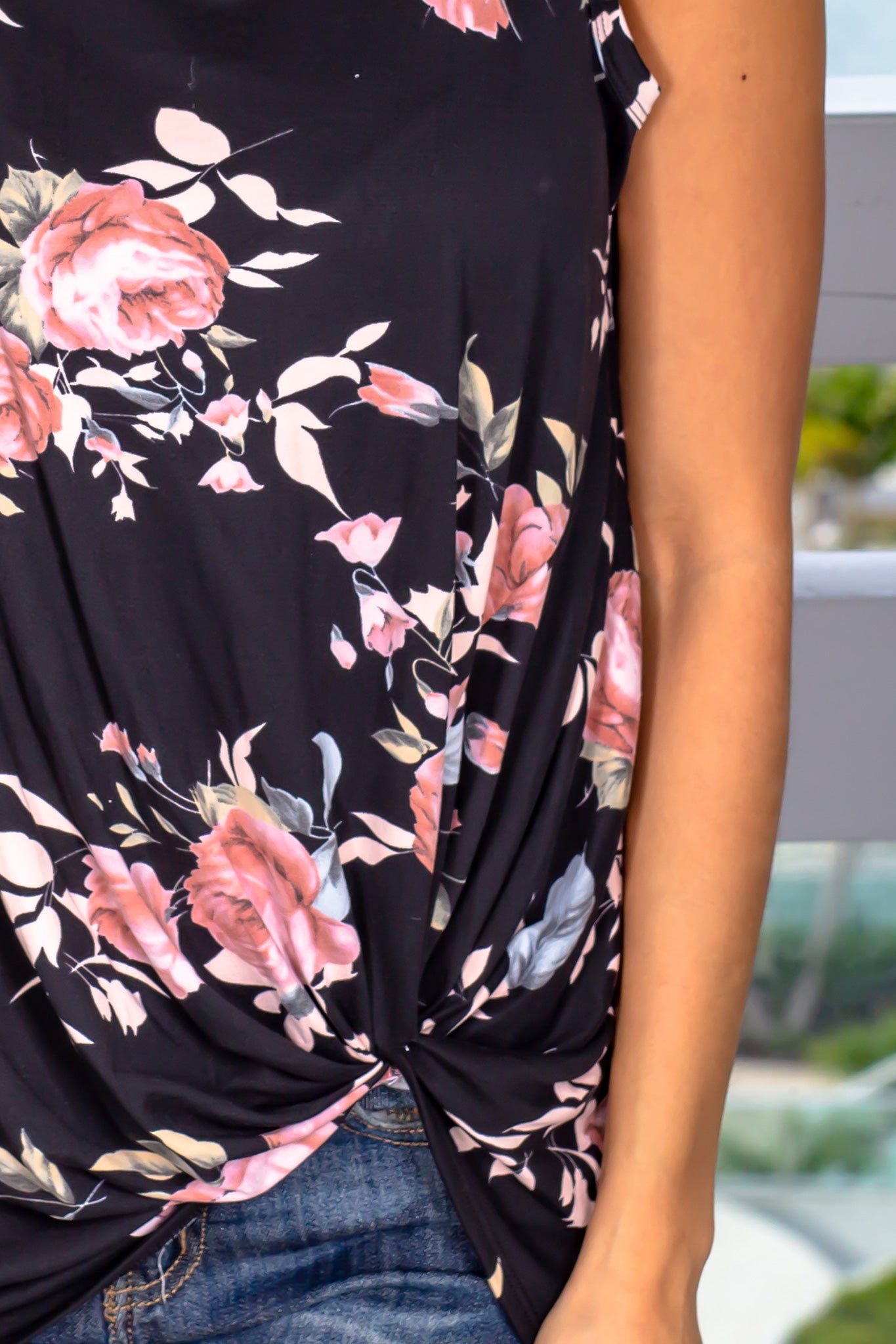 Stylish Black Floral Sleeveless Top with Front Twist Design