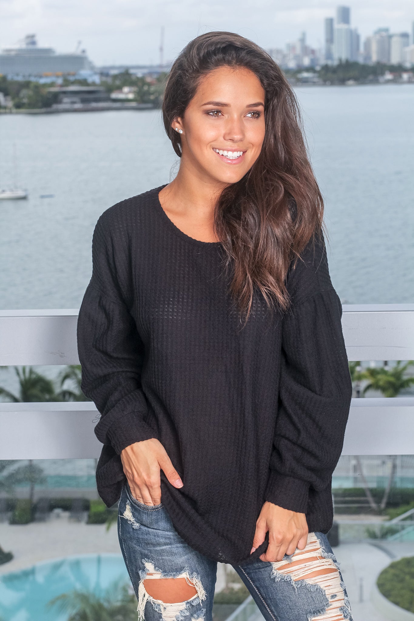 Cozy Black Long - Sleeve Knit Top with Stylish Open Back Design
