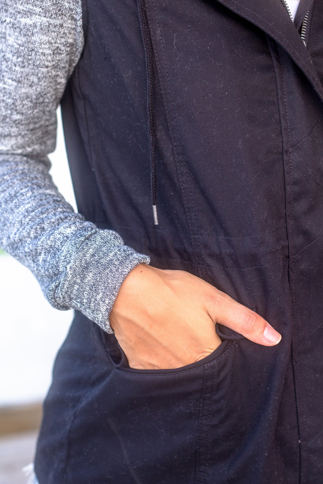 Stylish Black Jacket with Comfortable Gray Hood and Long Sleeves