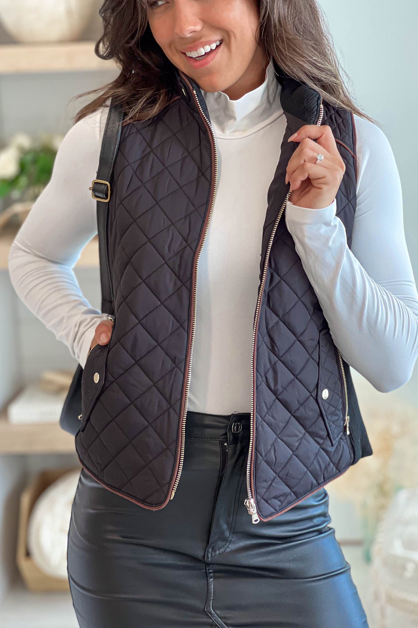 Stylish Black Quilted Women's Vest Featuring Convenient Front Pockets