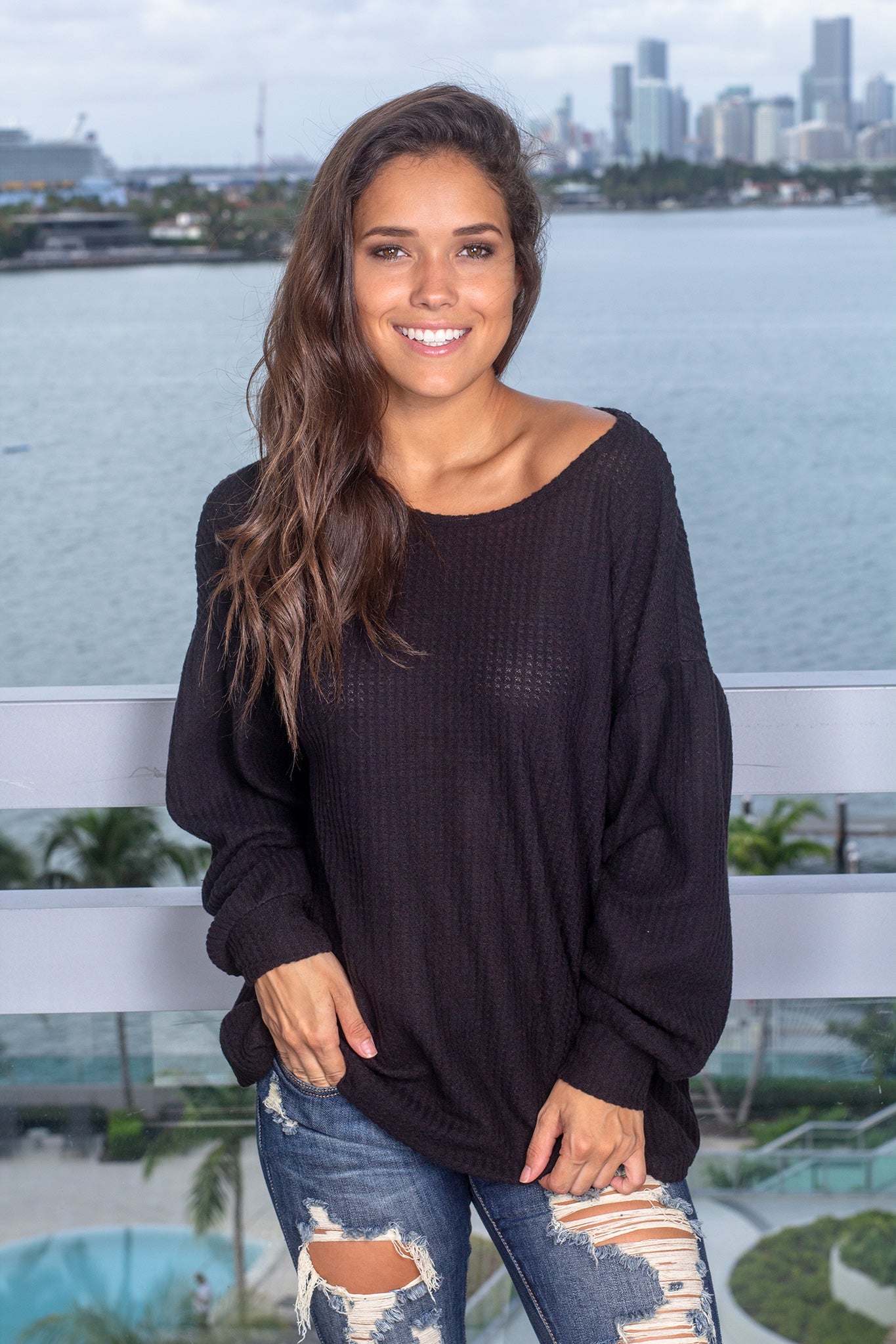 Cozy Black Long - Sleeve Knit Top with Stylish Open Back Design
