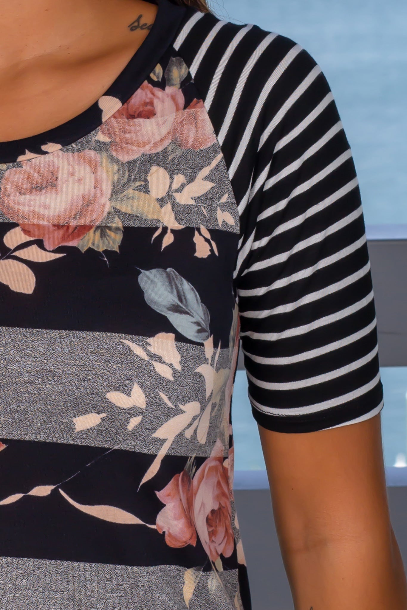 Stylish Black Floral Top with Eye - catching Striped Sleeves