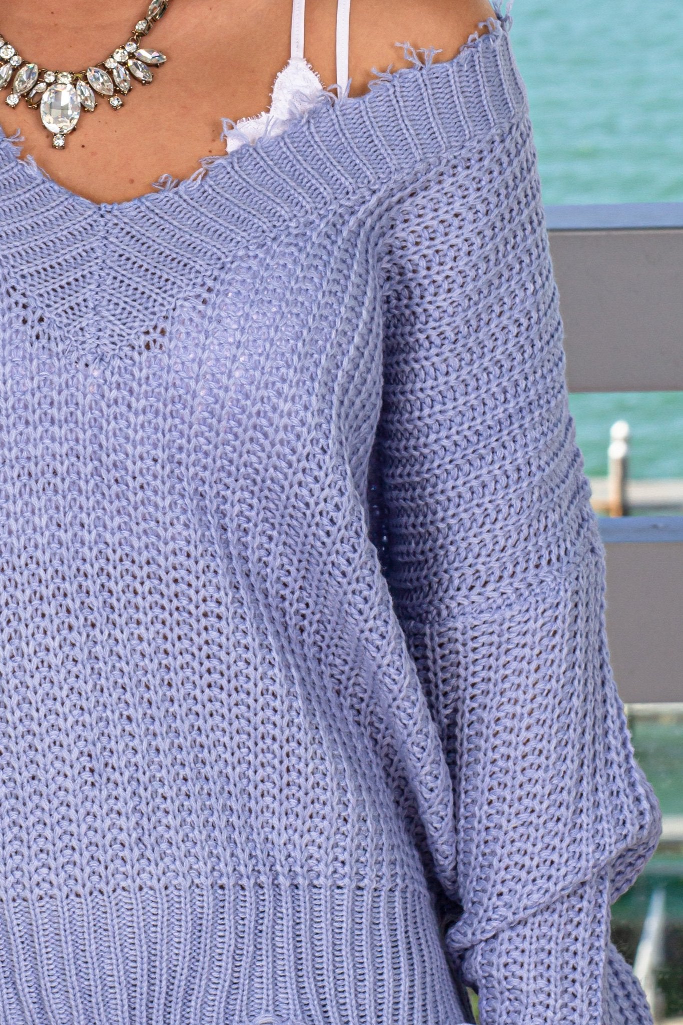 Stylish Blue V-Neck Knitted Sweater with Frayed Hems for Fall and Winter