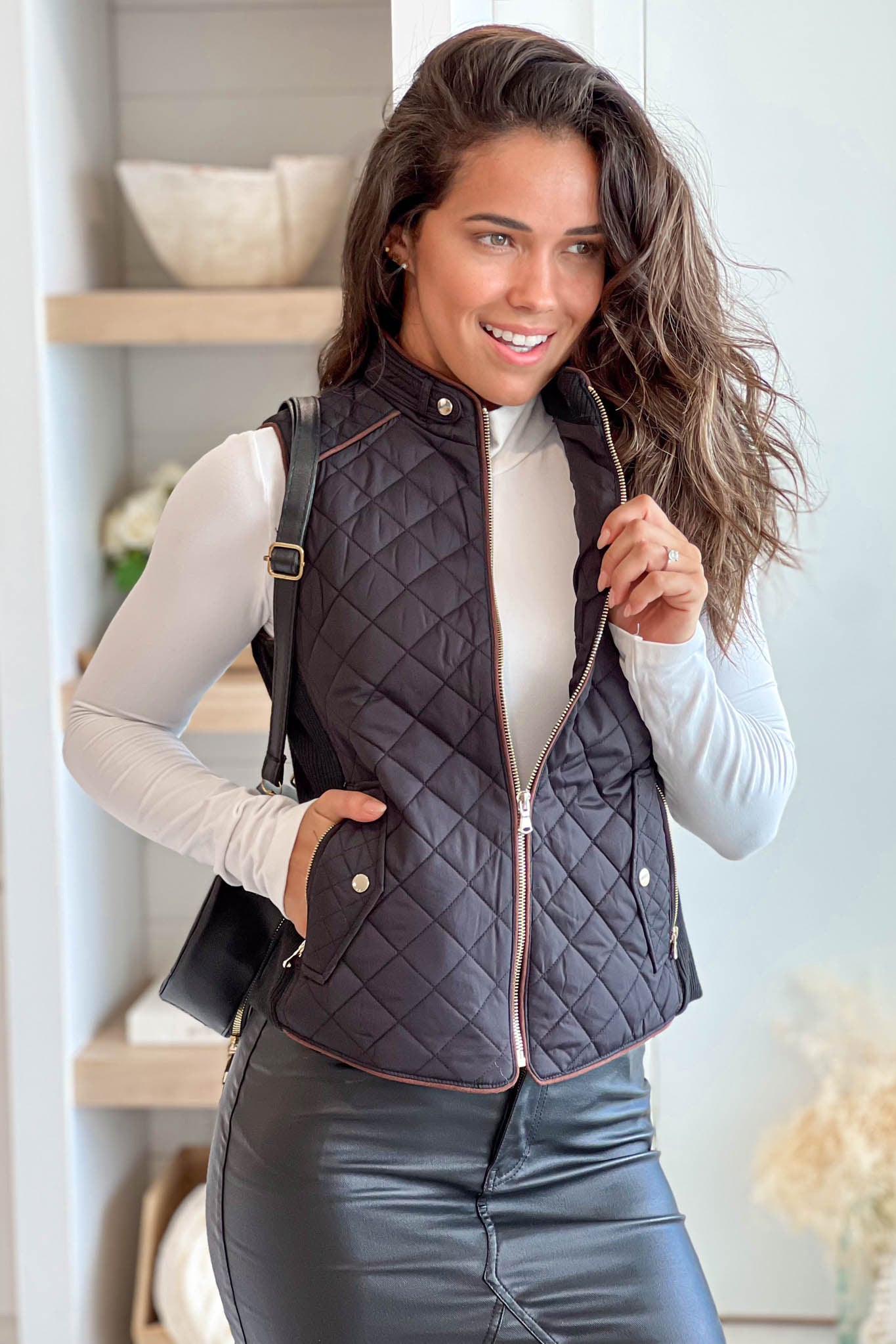 Stylish Black Quilted Women's Vest Featuring Convenient Front Pockets