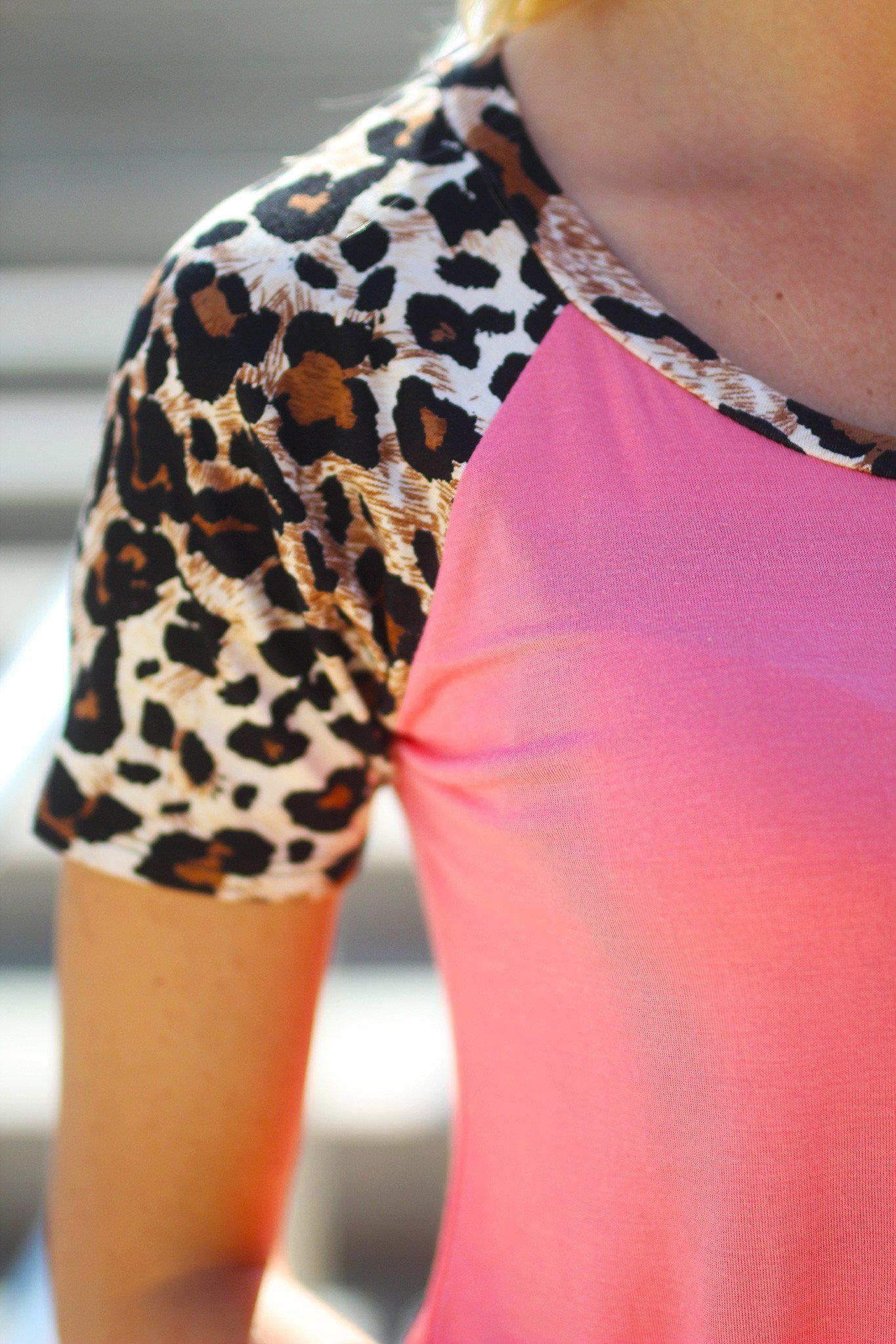 Stylish Women's Coral Colored Top Featuring Leopard Print Short Sleeves
