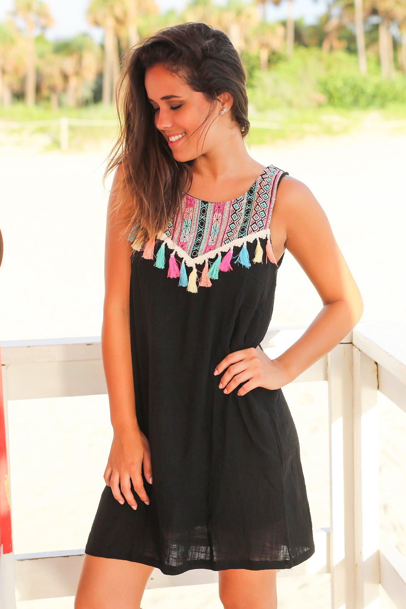 Stylish Black Short Dress Featuring Tassel Details and Colorful Prints