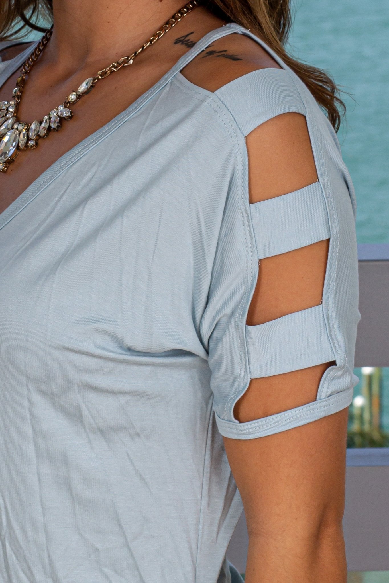 Classy Blue Women's Top with Decorative Strap Detail Sleeves